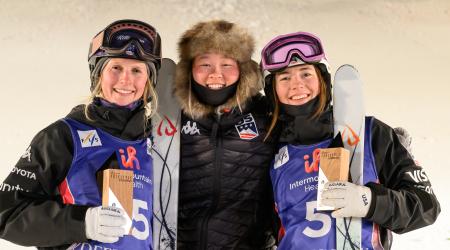 Jaelin Kauf, Kai Owens, and Hannah Soar smile with trophies at the 2023 Deer Valley World Cup