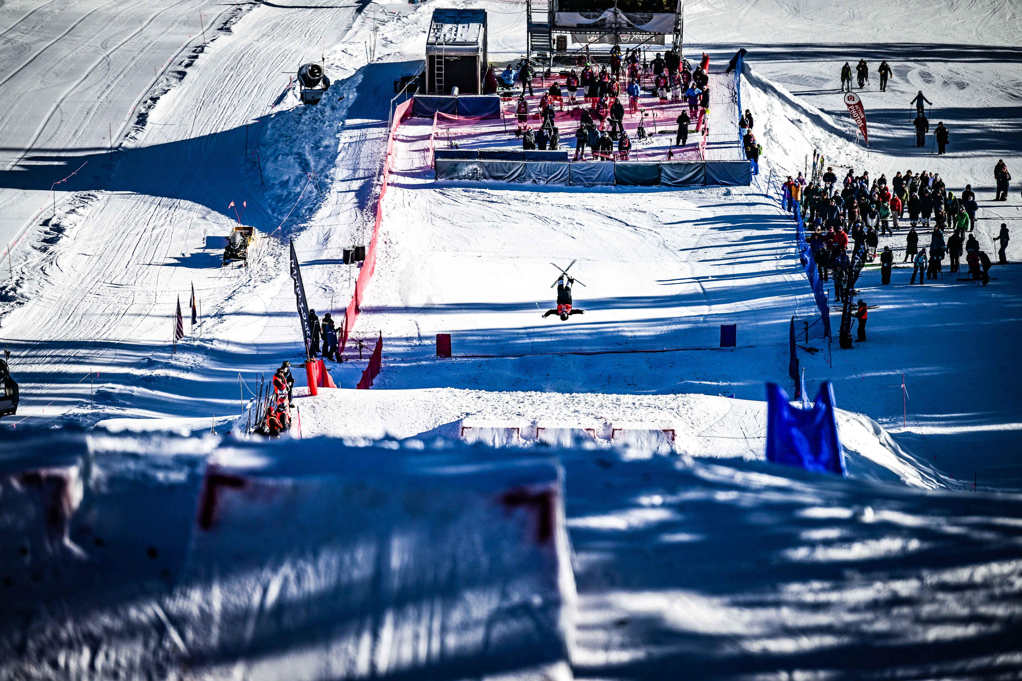 Athlete inverted on the bottom jump on Ambush mogul course