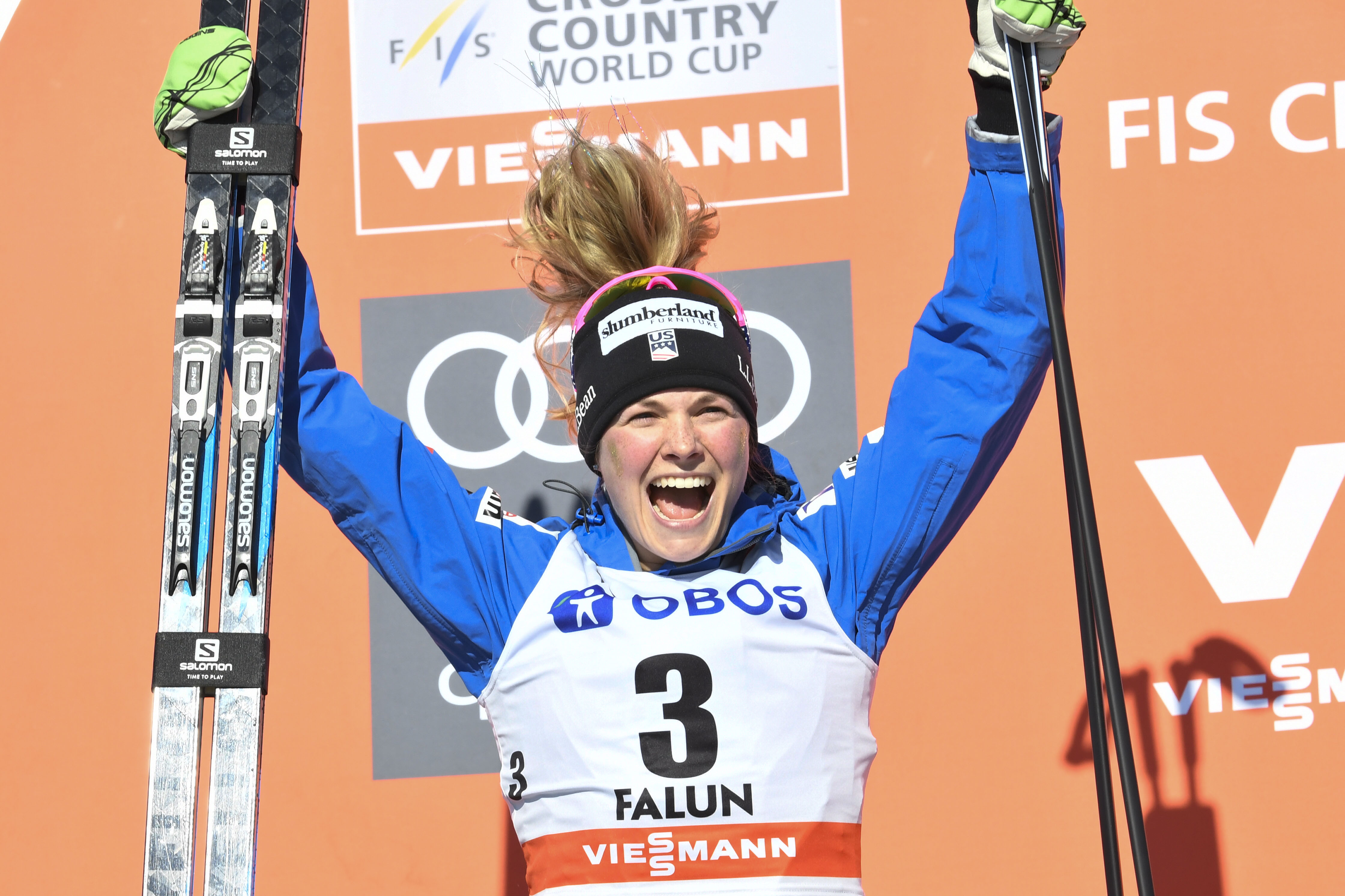 Jessica Diggins celebrates on the podium after finishing second in the FIS Cross Country World Cup 10k pursuit in Falun, Sweden. (Getty Images/AFP - Ulf Palm)