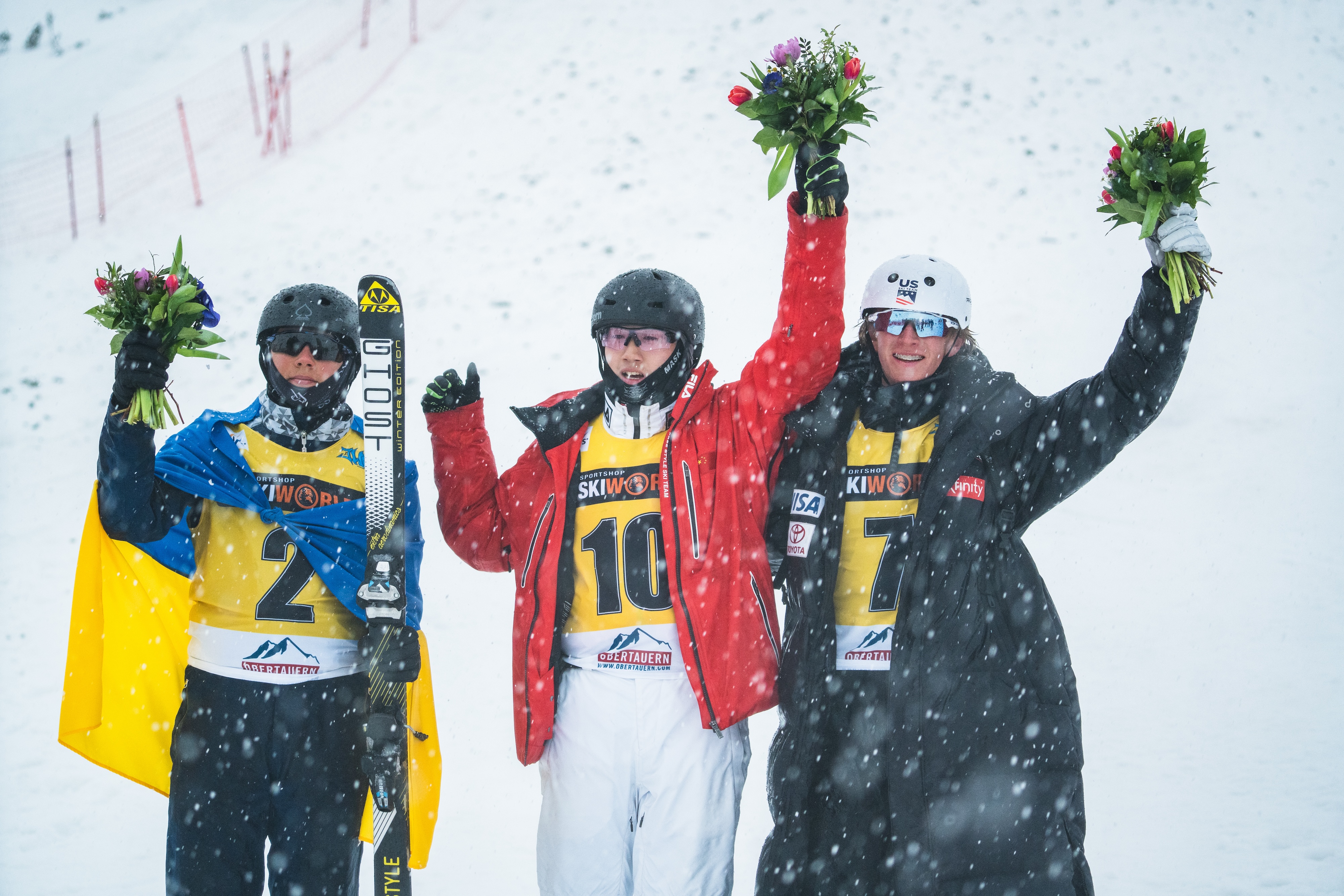 Connor Curran stands on the podium at the 2023 FIS Aerials Junior Ski World Championships in Obertauern, Austria