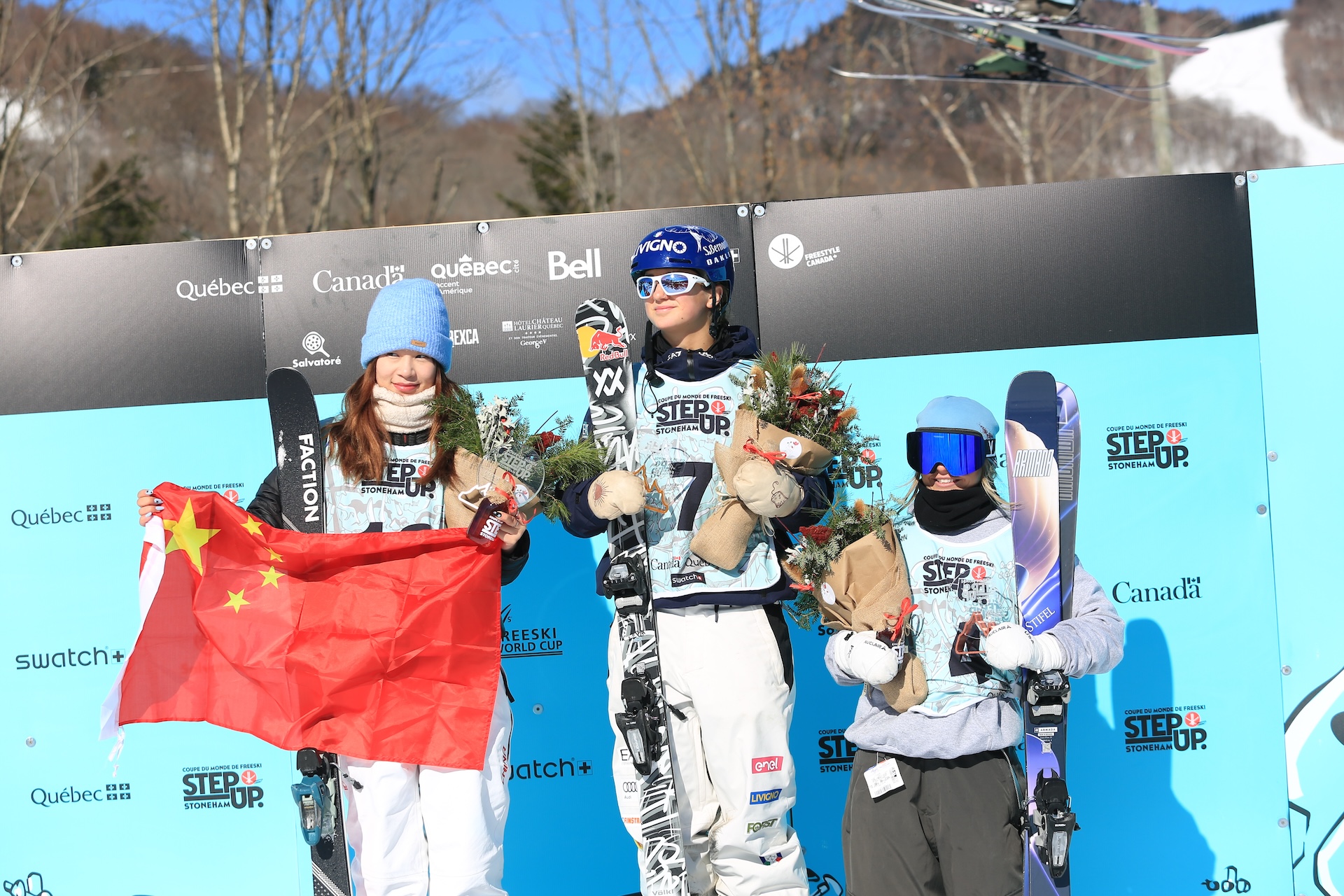 Harwood celebrating on the podium Rell Harwood on the podium with winner Flora Tabanelli and runner up Ruyi Yang