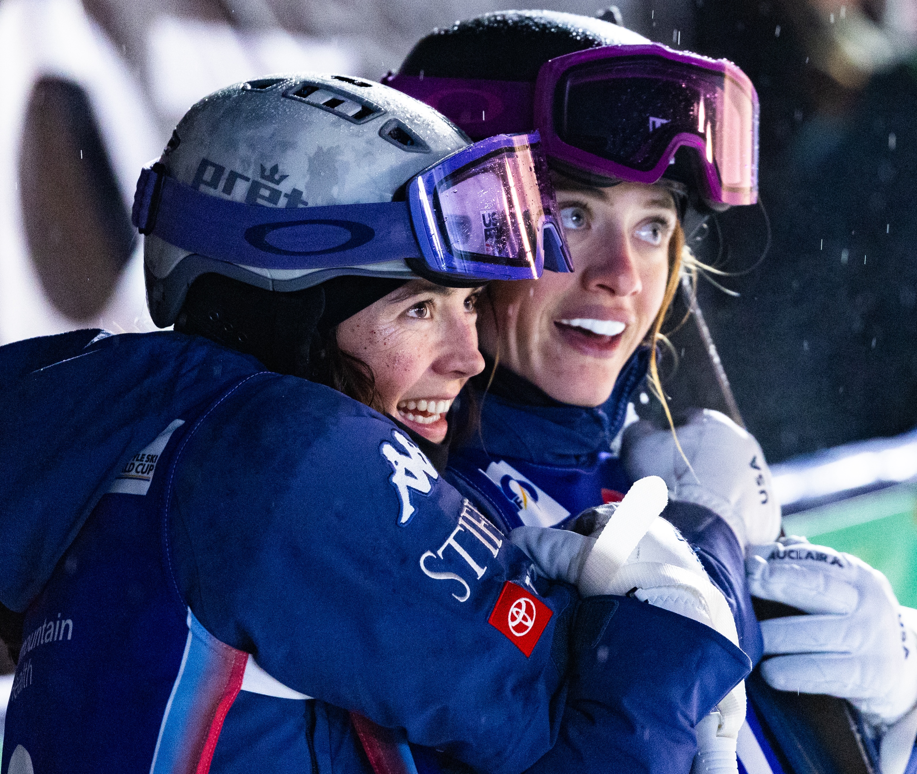 Jaelin Kauf and Olivia Giaccio hug at the 2024 Intermountain Health Freestyle International at Deer Valley