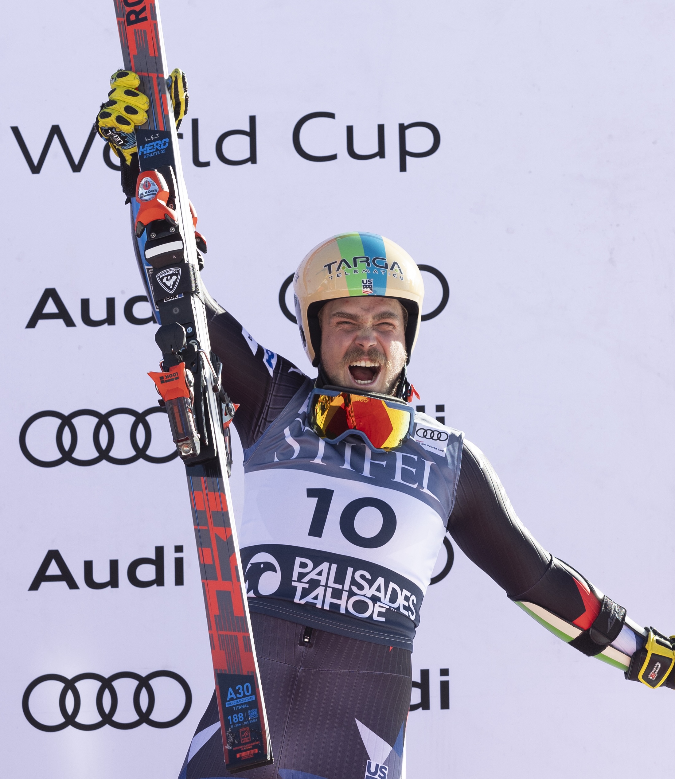 River Radamus celebrates on the podium at Palisades Tahoe