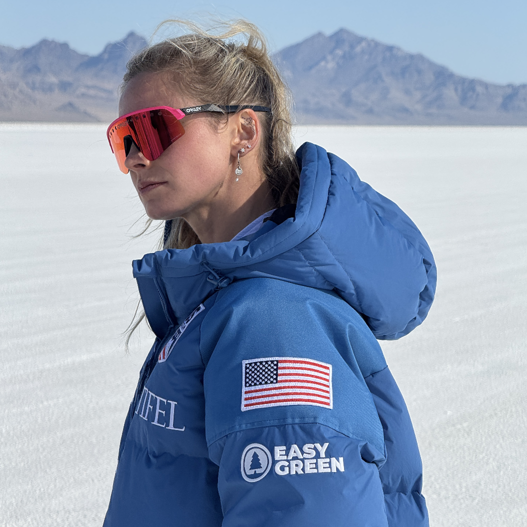 Jessie Diggins wearing a U.S. Ski & Snowboard jacket with an Easy Green patch