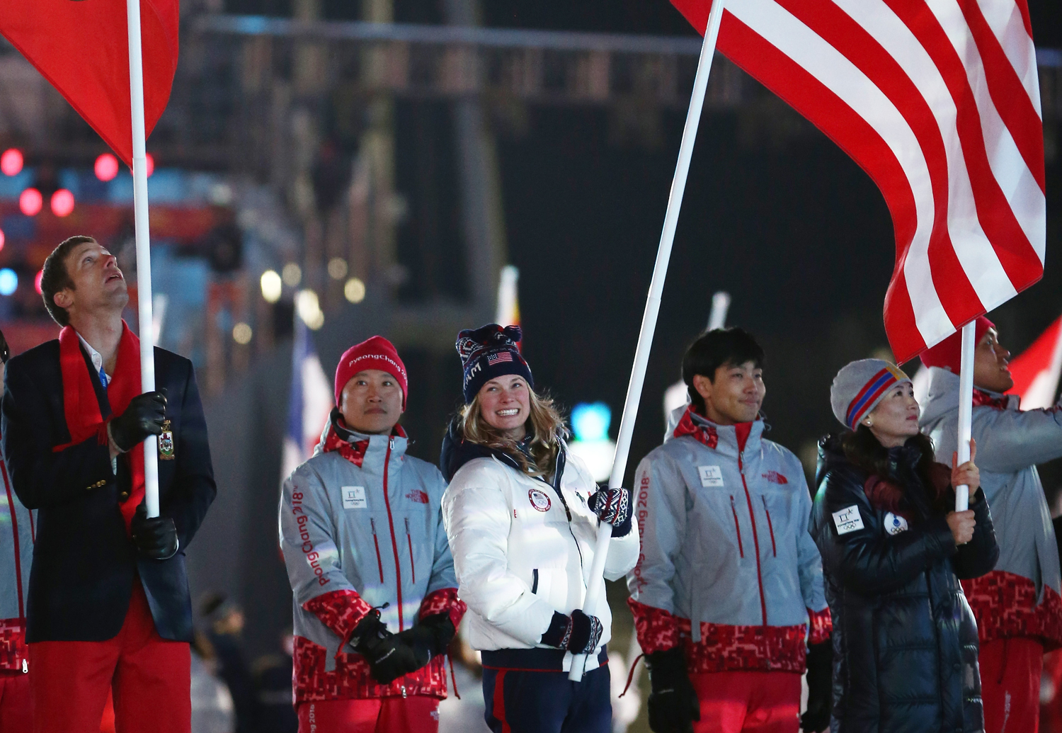 Team USA flag bearer Jessica Diggins participates in the Parade of Athletes during the Closing Ceremony of the 2018 Olympic Winter Games at PyeongChang Olympic Stadium Sunday. (Getty Images - Dan Istitene)