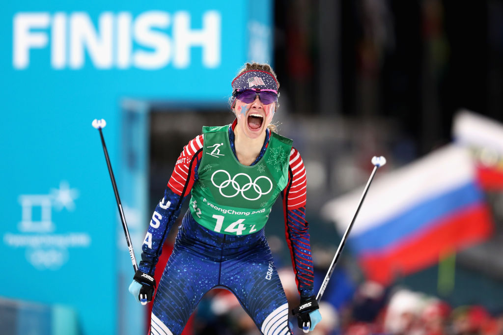 Jessica Diggins celebrates as she crosses the line to win gold during the team sprint at the 2018 Olympic Winter Games. (Getty Images - Lars Baron)