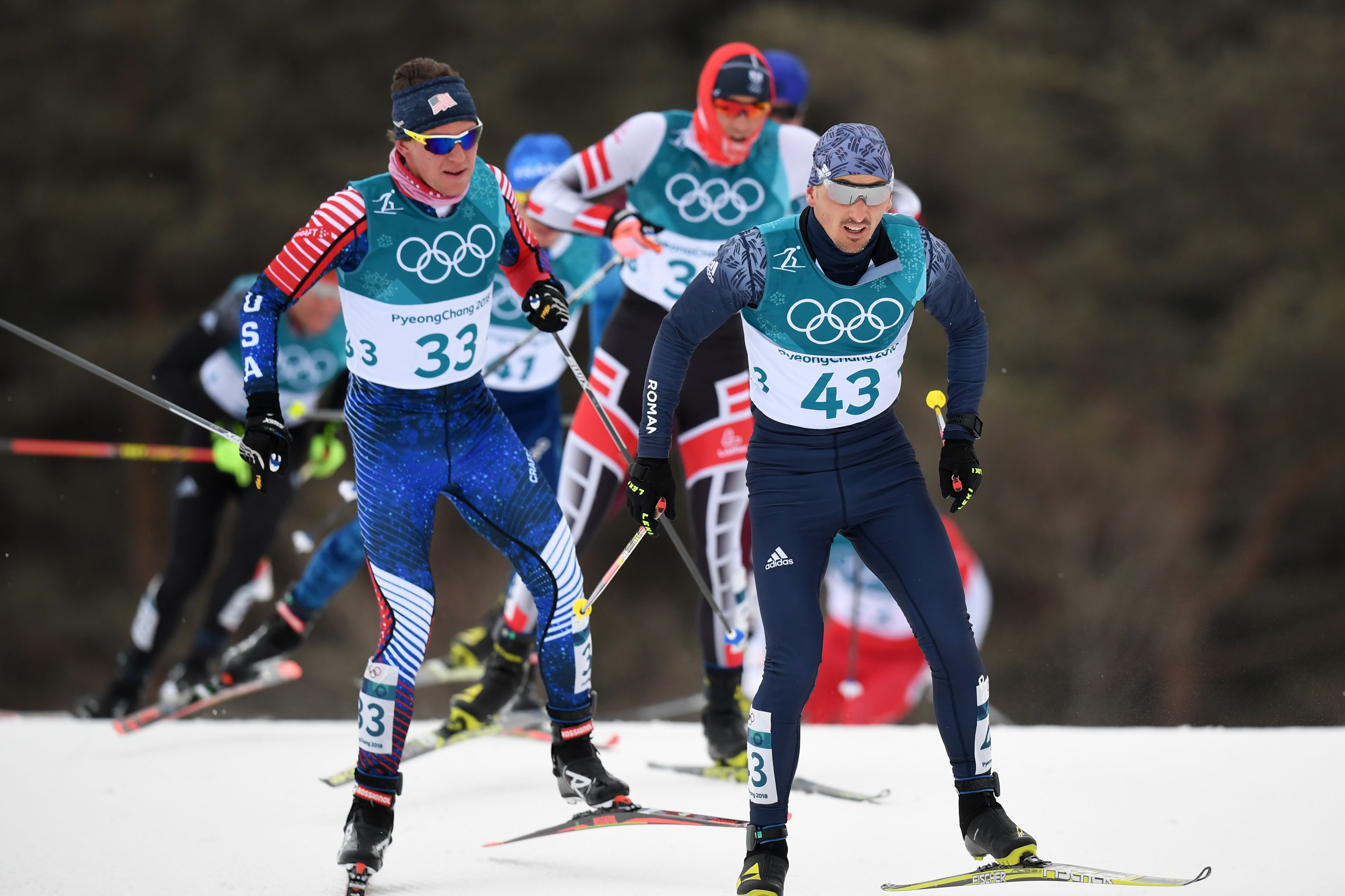Scott Patterson (33) and Romania's Paul Constantin Pepene compete in the skiathlon at the Alpensia Cross Country Skiing Centre  Sunday. (Getty Images/AFP - Franck Fife)