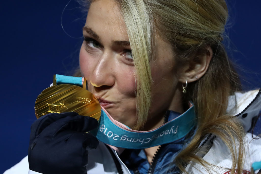 Gold medalist Mikaela Shiffrin kisses her medal during the medal ceremony for the giant slalom on day six of the PyeongChang 2018 Olympic Winter Games at Medal Plaza in Pyeongchang-gun, South Korea. (Getty Images - Alexander Hassenstein)