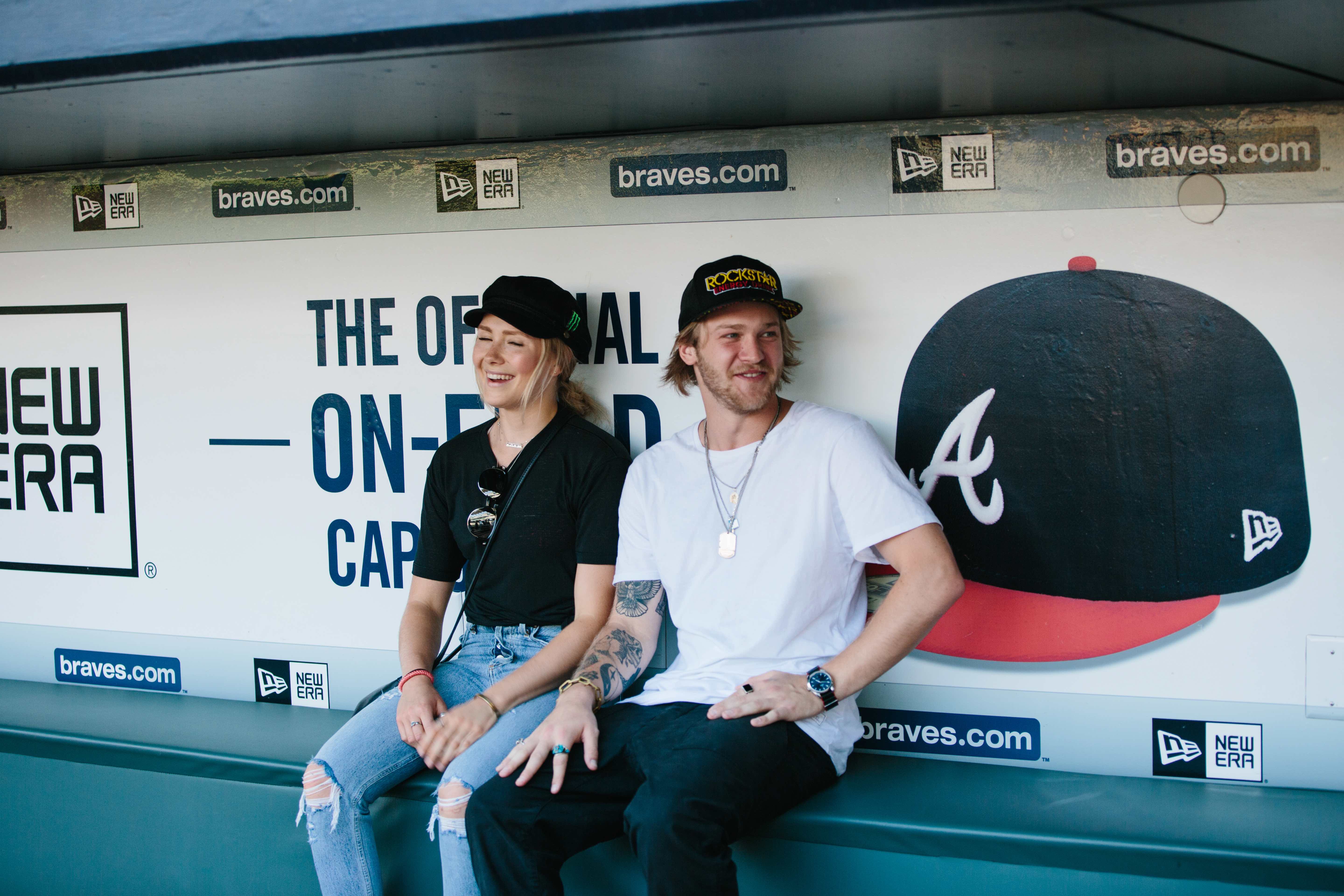 Kyle Mack and Maggie Voisin in the dugout at the Visa Big Air presented by Land Rover Announcement at SunTrust Park. (U.S. Ski & Snowboard - Sarah Brunson) Maggie and Kyle Dugout