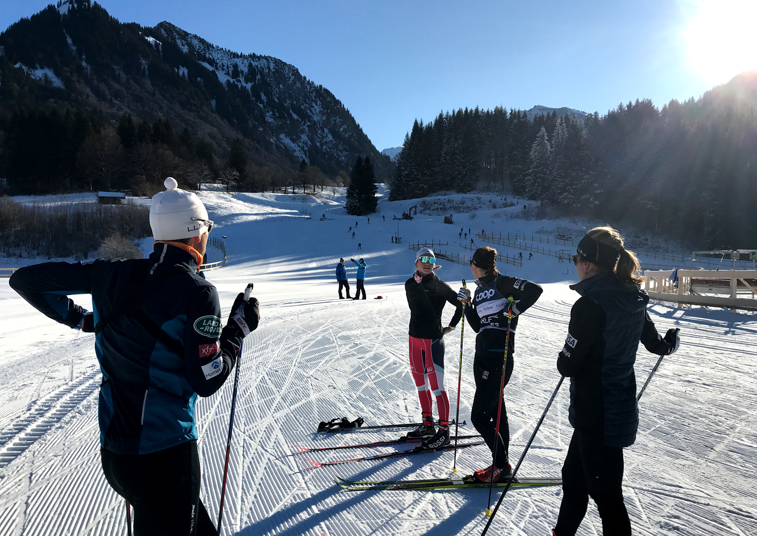 Davis U.S. Cross Country Head Coach Chris Grover (left) talks with Rosie Brennan, Julia Kern, and Alayna Sonnesyn Wednesday during training in Oberstdorf, Germany.  (U.S. Ski & Snowboard - Tom Horrocks) Davis U.S. Cross Country Head Coach Chris Grover (left) talks with Rosie Brennan, Julia Kern, and Alayna Sonnesyn Wednesday during training in Oberstdorf, Germany.  (U.S. Ski & Snowboard - Tom Horrocks)