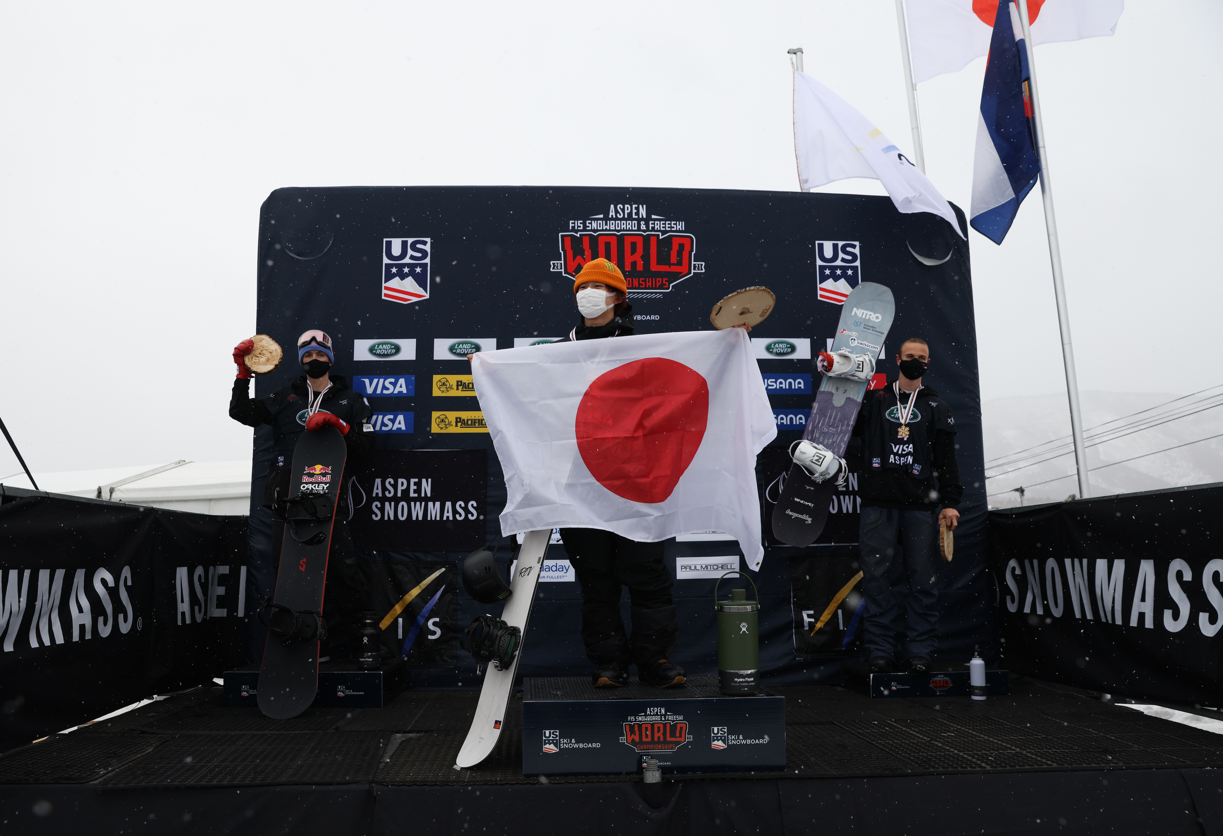 Australia's Scotty James (left), Japan's Yuto Totsuka (center), and Switzerland's Jan Scherrer (right) on the podium at the Aspen 2021 Snowboard and Freeski World Championships snowboard halfpipe finals. (U.S. Ski & Snowboard - Sarah Brunson) Men's snowboard halfpipe podium