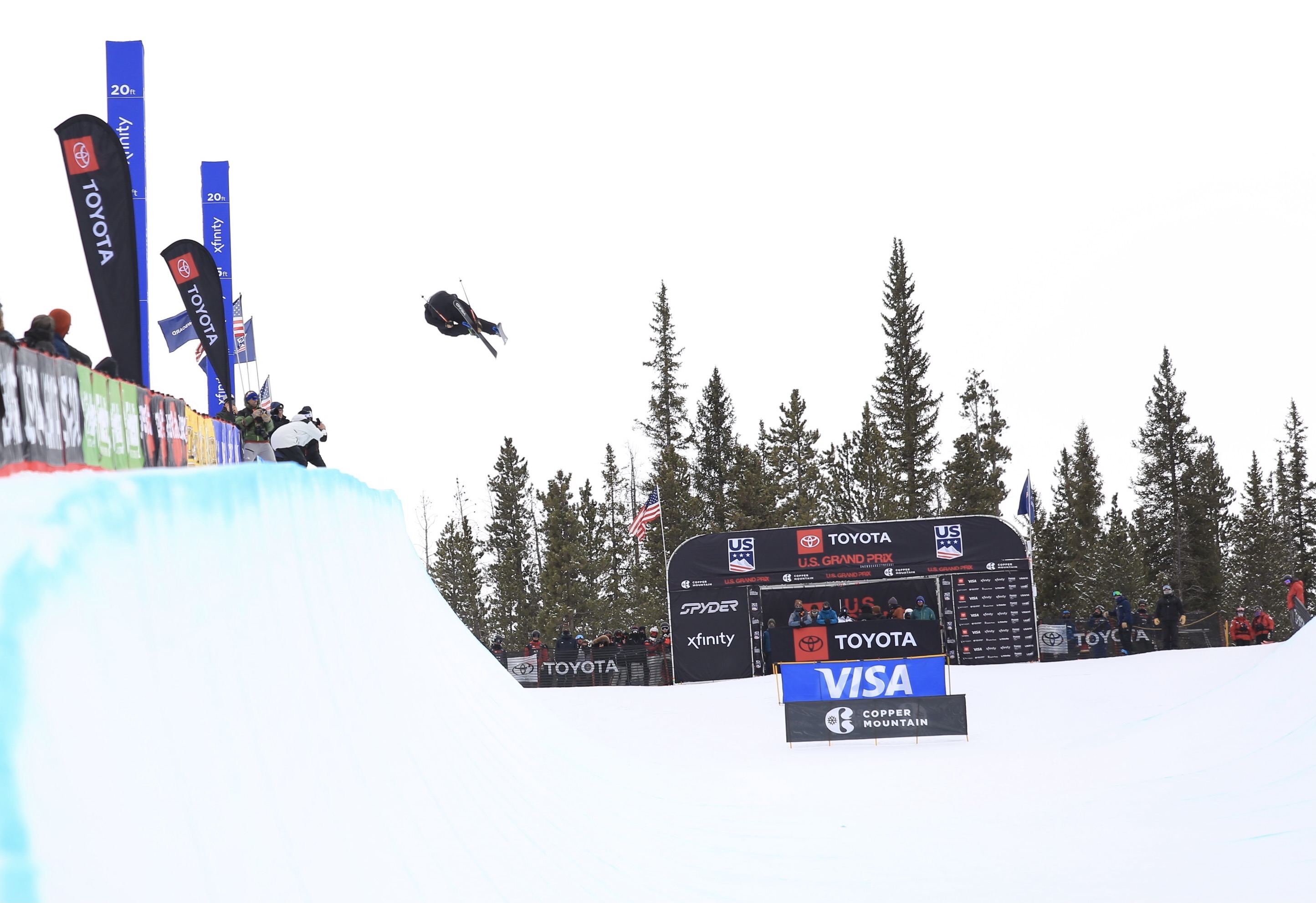 Freeskier Aaron Blunck boosting mid- right side 1080 on the top hit in the halfpipe.