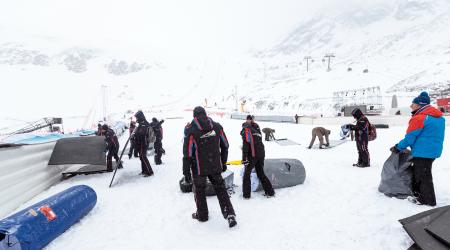 Workers dismantle the venue after the cancellation of the Men's Giant Slalom race at the FIS Alpine Ski World Cup in Soelden, Austria, on October 29, 2017 due to bad weather conditions.