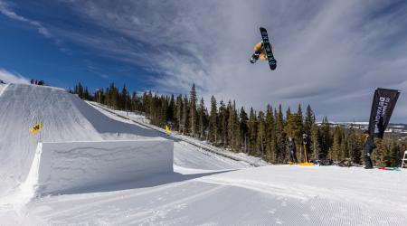 Jamie Anderson airs on her snowboard. 