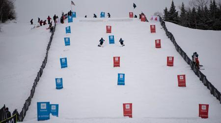 Athletes skiing on a moguls course at Waterville