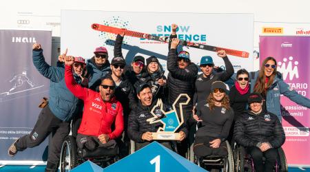 A group photo of the team on the podium in Cortina following Andrew Kurka's downhill win