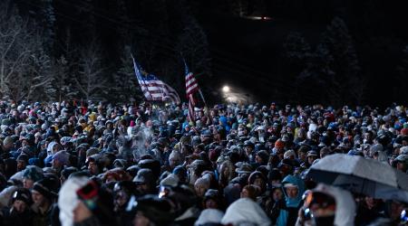 a large crowd gathers at the bottom of the moguls course at Deer Valley Resort