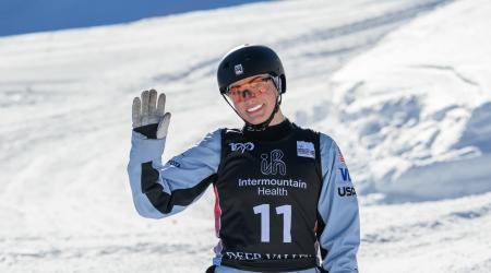 megan smallhouse waves at the camera