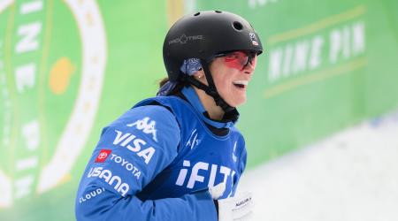 Karenna Elliott excited in the finish after her jump in Lake Placid New York