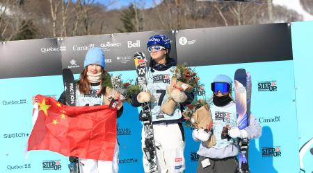 Rell Harwood on the podium with winner Flora Tabanelli and runner up Ruyi Yang